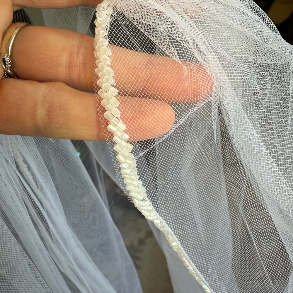 Fingertip length 36” veil. Color white. Frosted beaded edge. NWOT